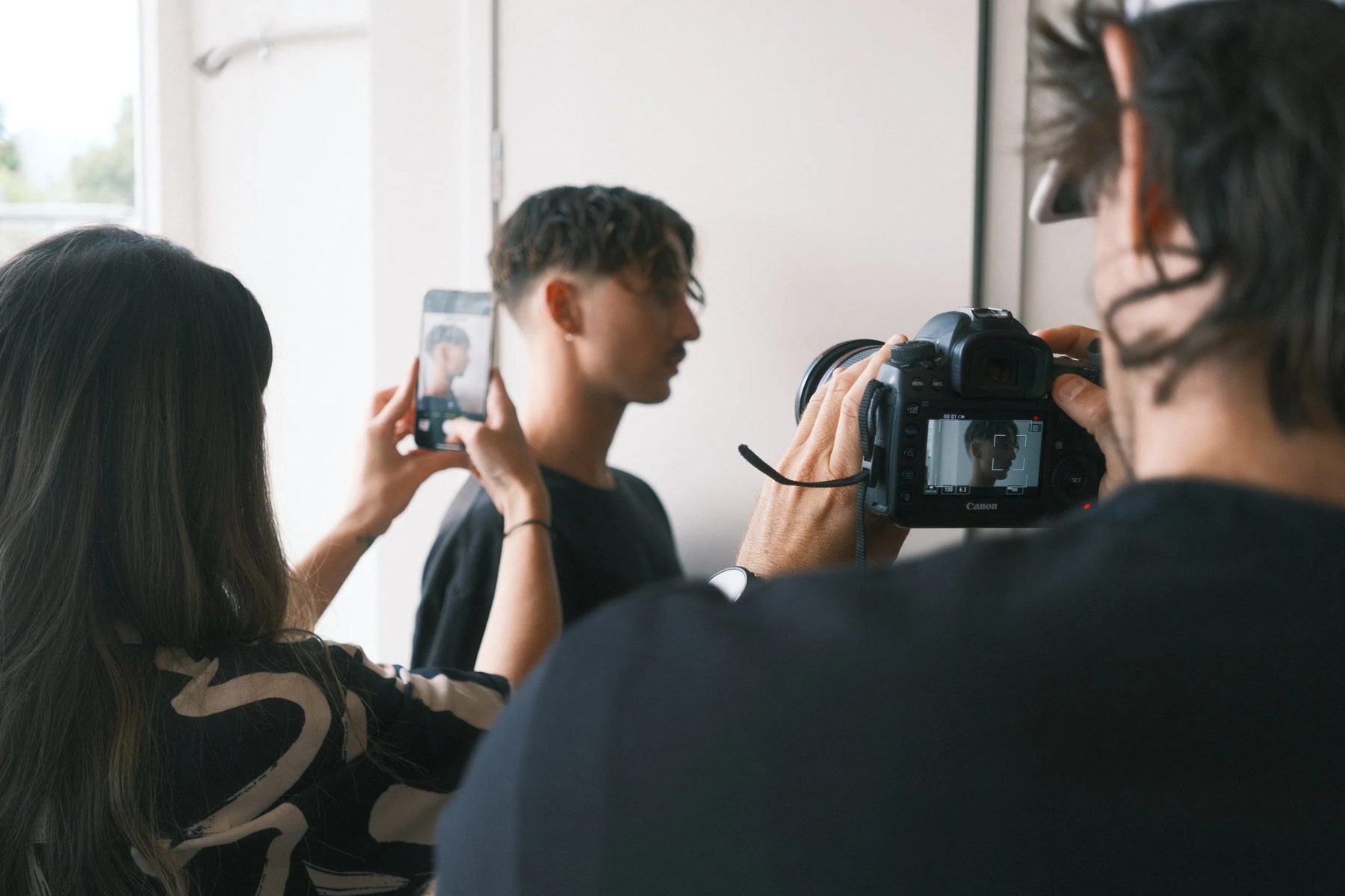 The Paragon team reviewing shots during a photo session